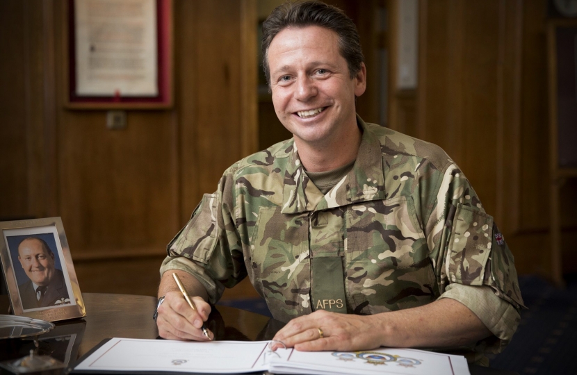 Nigel Huddleston MP signing the Visitor's Book at RAF Shawbury