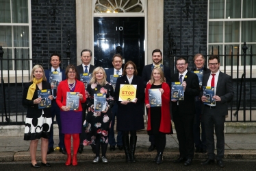 Cross party group of MPs delivering puppy smuggling petition to Downing Street